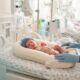 Neonatal developmental positioning aids for NICU infants